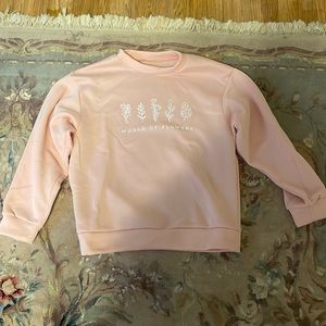 comfortable and loose, light pink, goes well with loose or tight pants